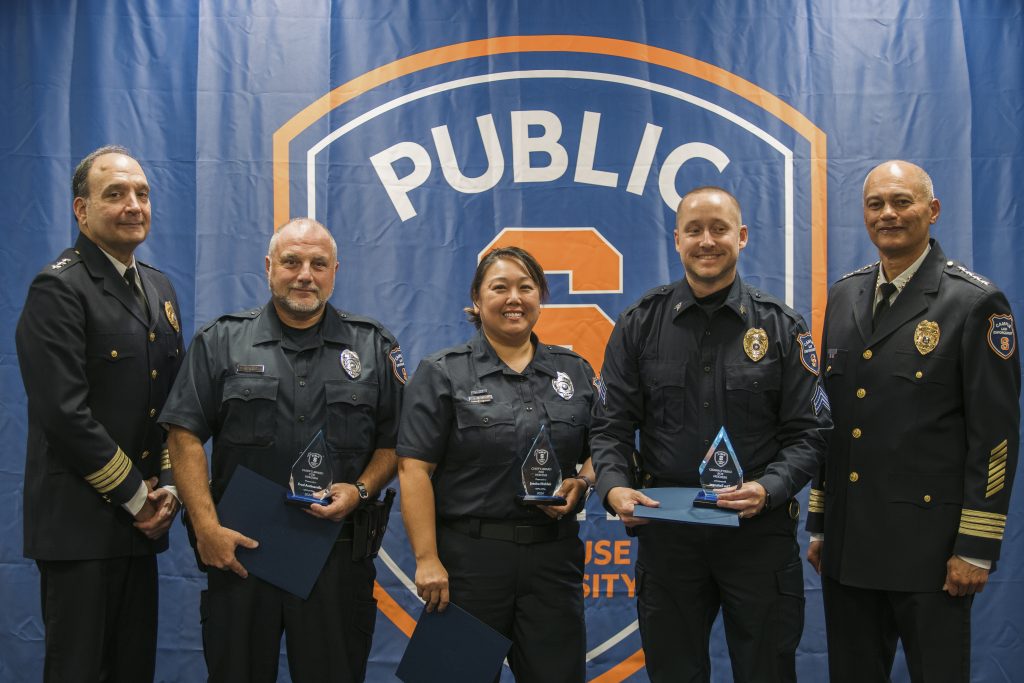 Freddie, Jessica and Tim accepting their award