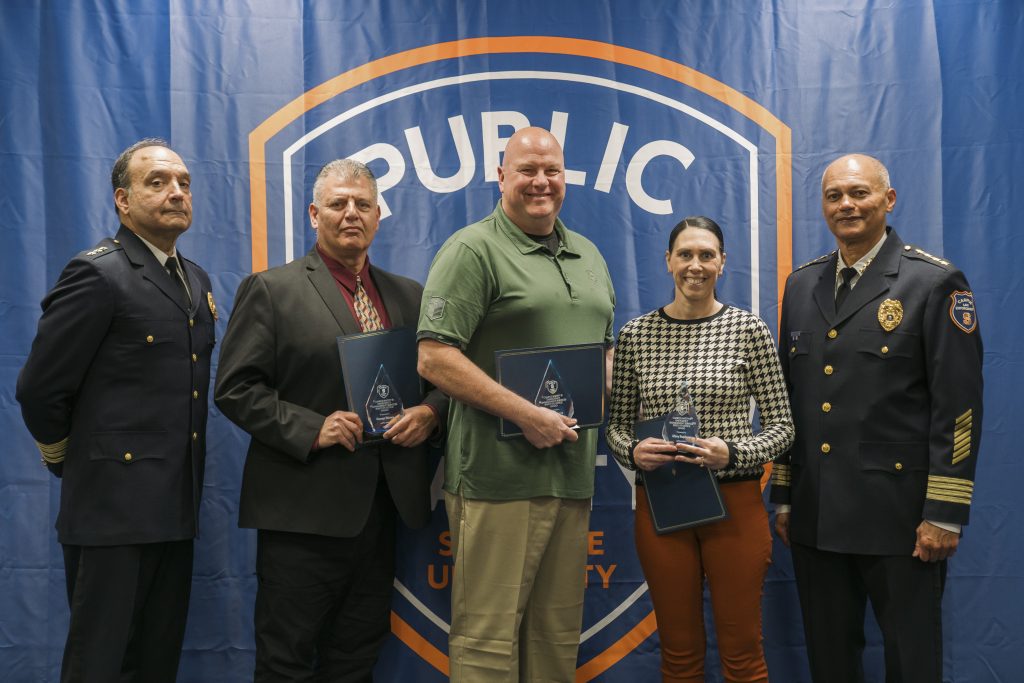 George, John and Misty accepting their award