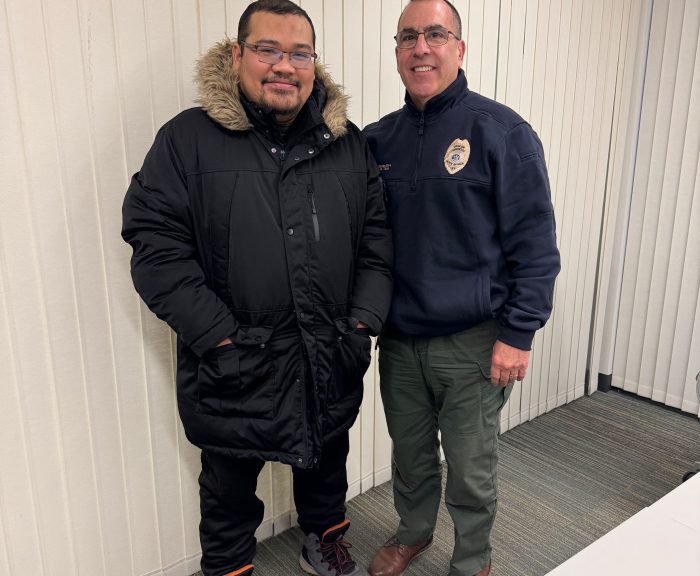 International Student Fridgo Tasman stands with Detective Mike Toia