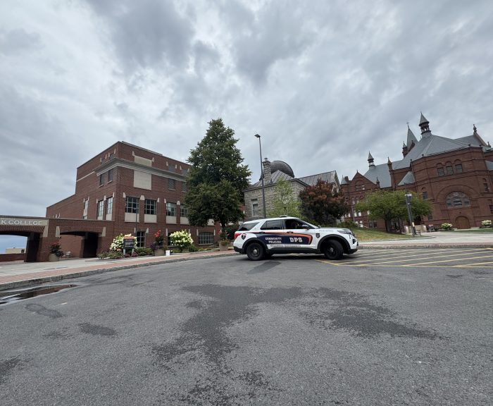 DPS car parked in front of Crouse Hinds College and Falk College